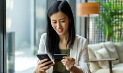 Women making payment on smartphone